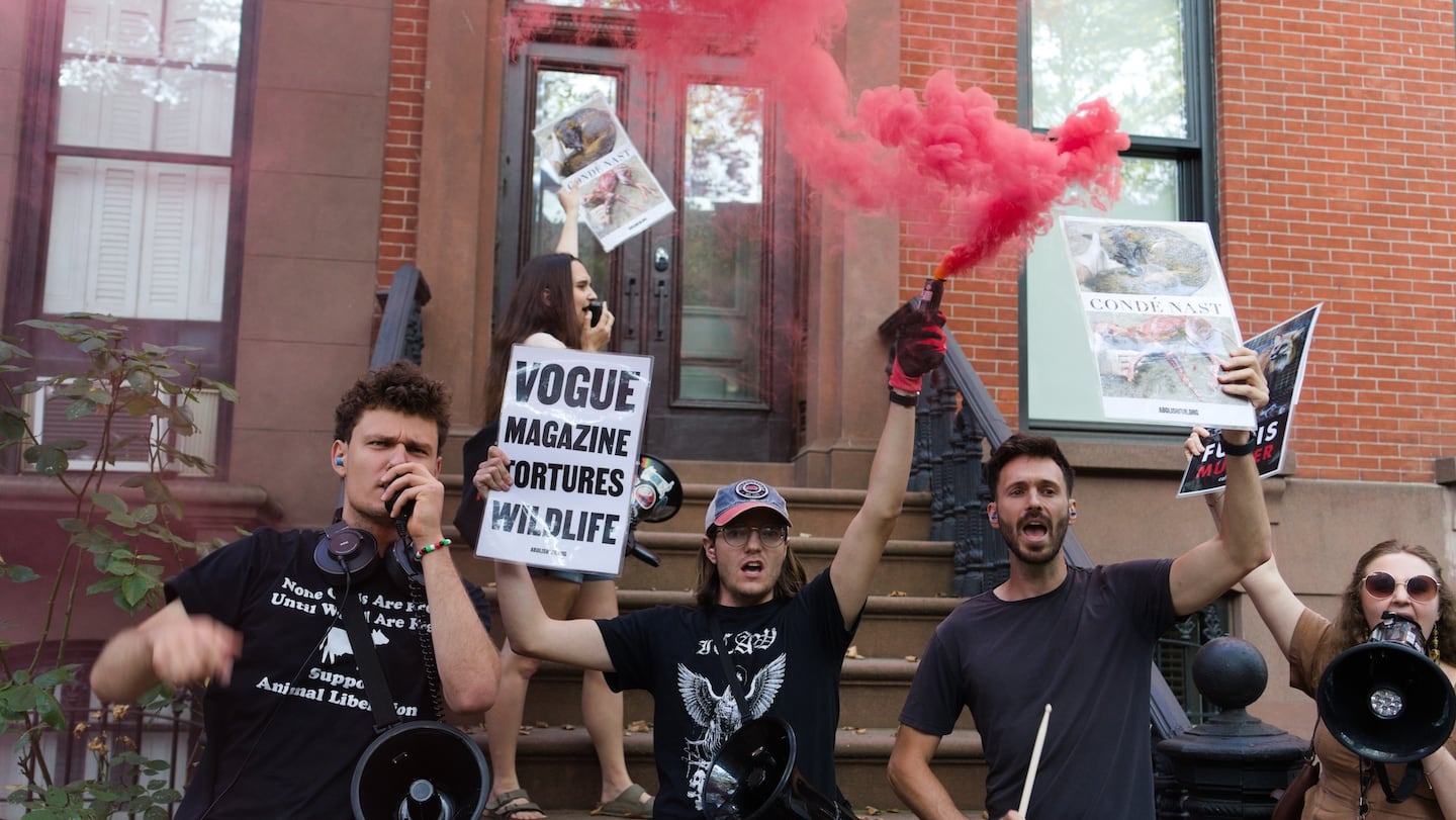 Activists for The Coalition to Abolish the Fur Trade protest outside a Conde Nast executive's home.