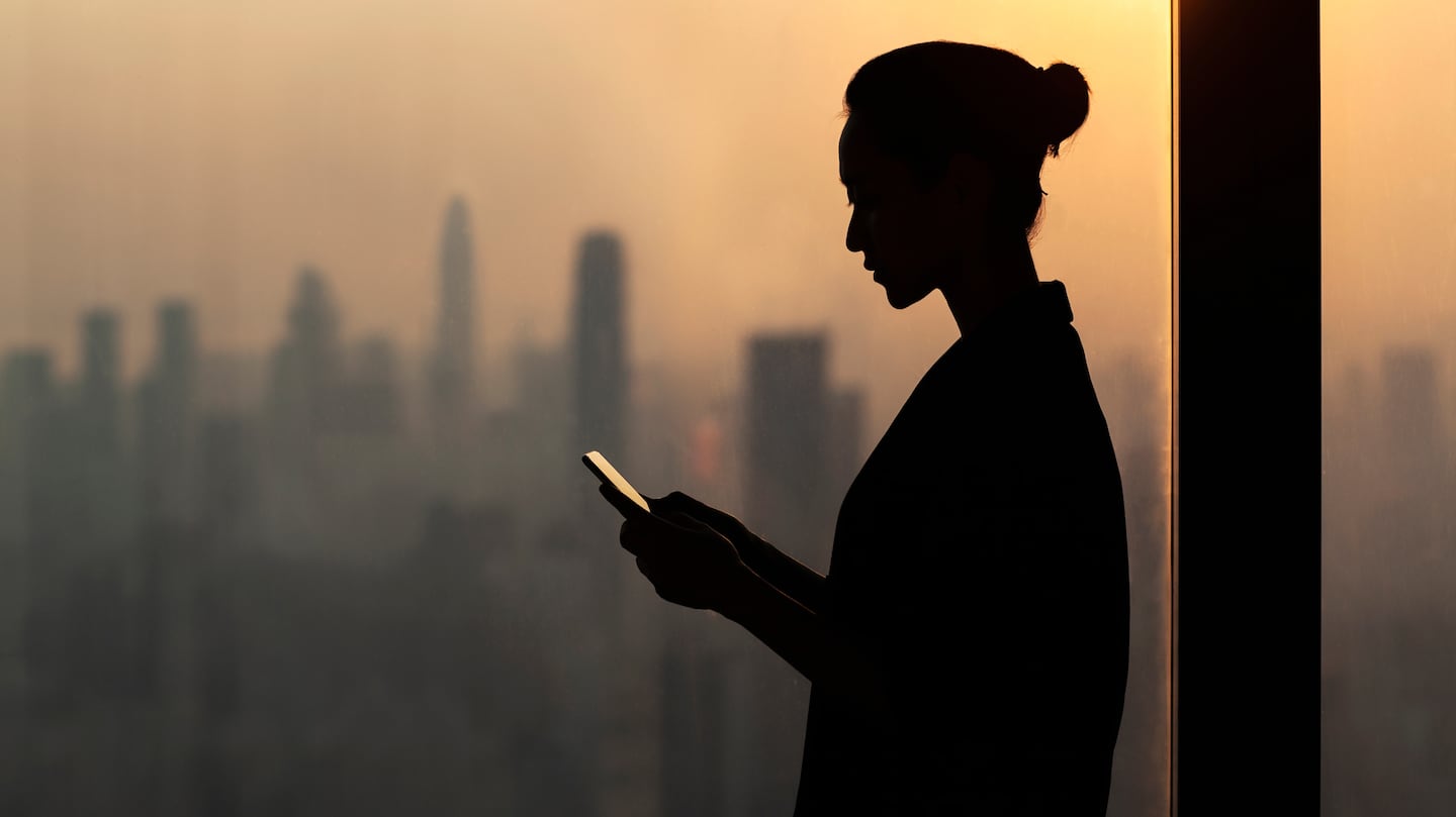 Woman looking at phone screen