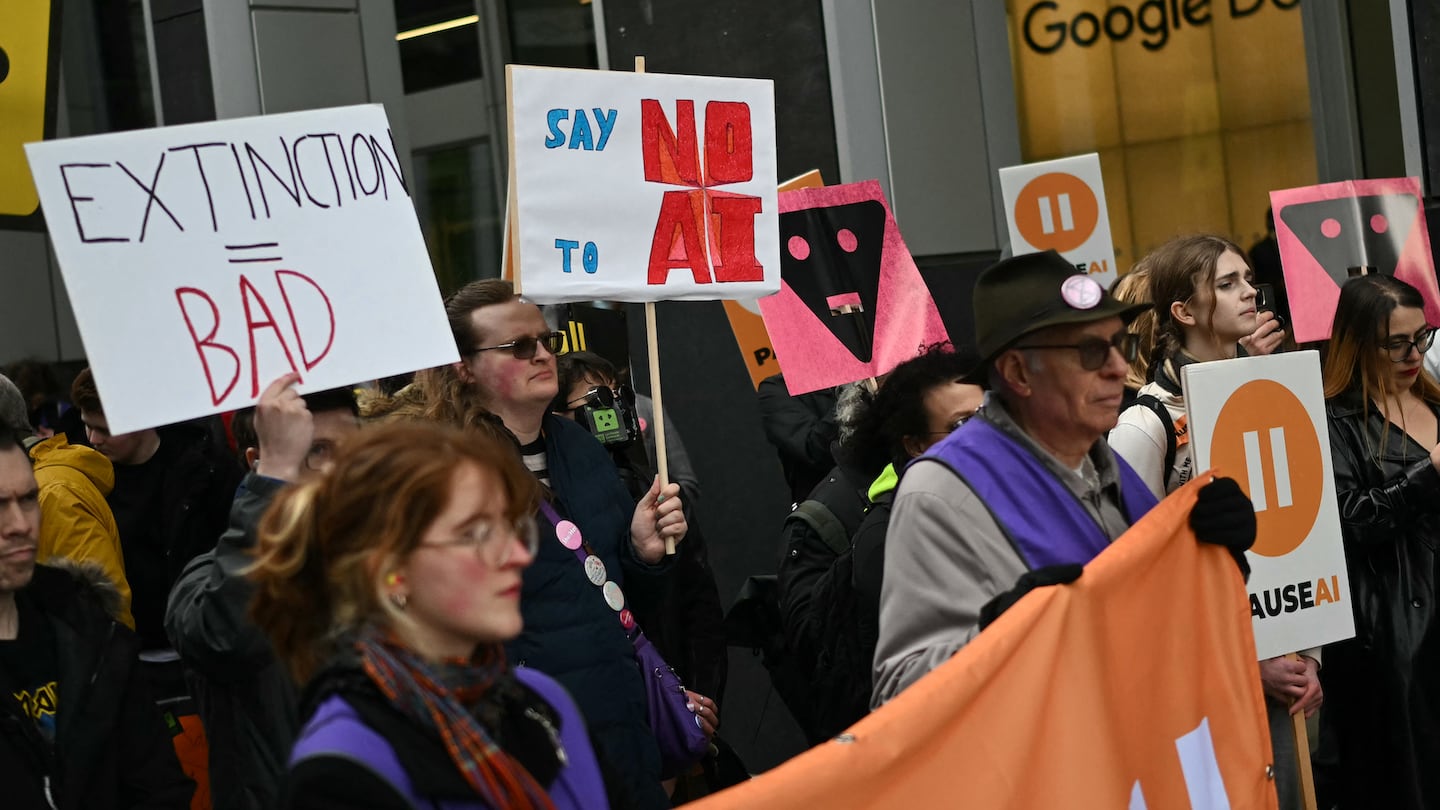 Protesters gather with banners and placards outside the offices of Google Deepmind at a protest organized by PauseAI UK and other groups concerned in controlling the development of advanced Artificial Intelligence systems, in London on February 28, 2026.